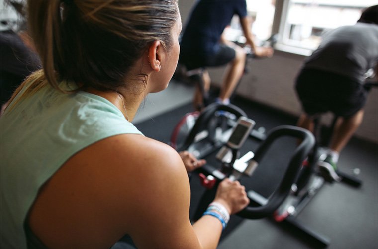 Stocksy-Rob-and-Julia-Campbell-Group-of-people-in-spin-class-together.jpg