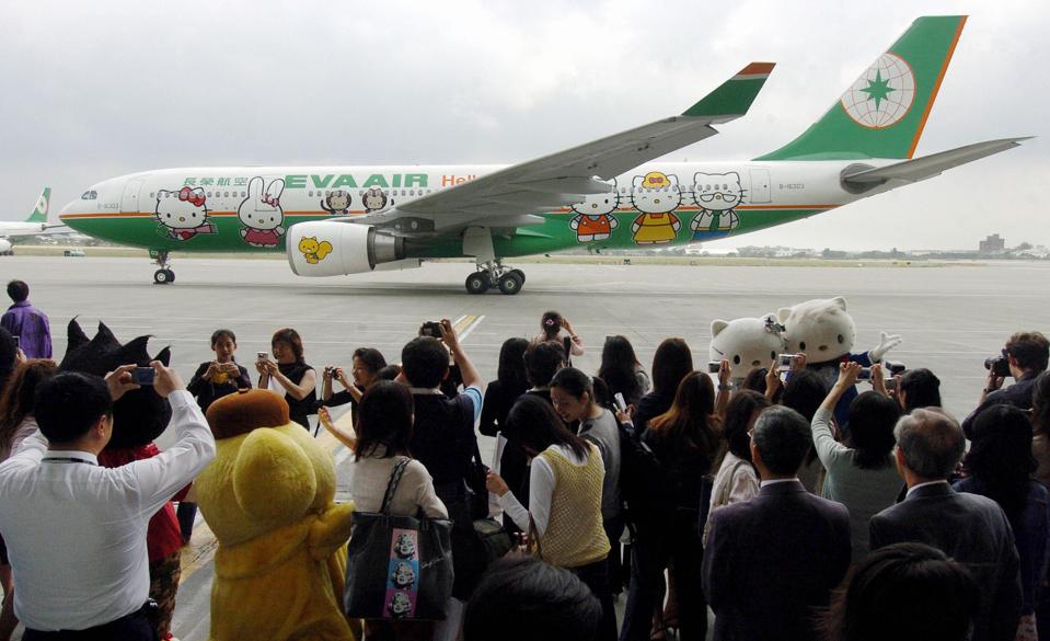 Local journalists take photos of EVA air