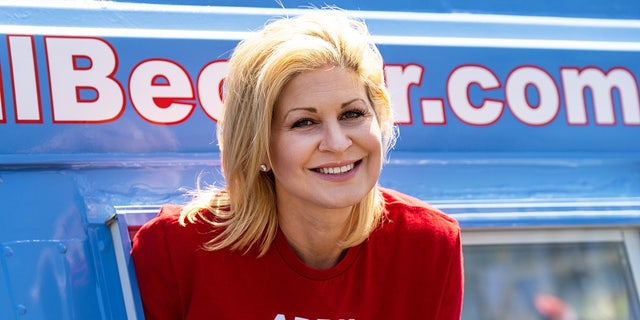 Republican candidate for U.S. Congress April Becker poses in the window of her campaign van, a converted ice cream truck, in Las Vegas on Sunday, May 29, 2022.